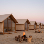 freepik luxury glamping tents on a sandy beach at sunset m 32547